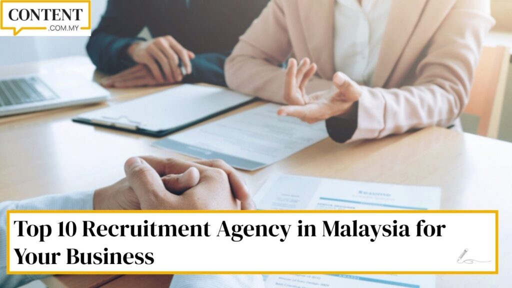 Photo of HR personnel and a candidate sitting at a table, representing hiring via a recruitment agency in Malaysia