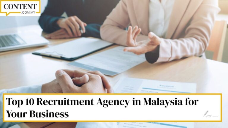 Photo of HR personnel and a candidate sitting at a table, representing hiring via a recruitment agency in Malaysia